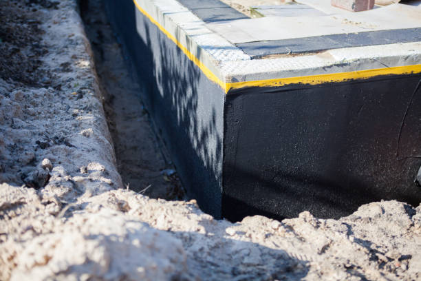 Professional Waterproofing technician working in Cliffside Park, NJ